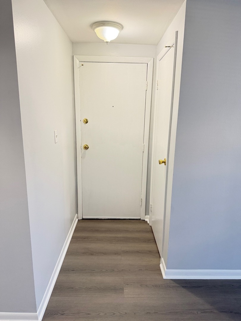 1110 18th Street, Unit GE Broadview, IL 60155 - Photo 2 of 20 a view of a hallway with wooden floor