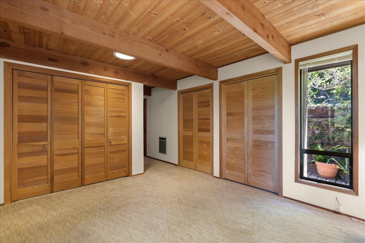 15171 Old Ranch Road Los Gatos, CA 95033 - Photo 12 of 26 an empty room with furniture wooden floor and window