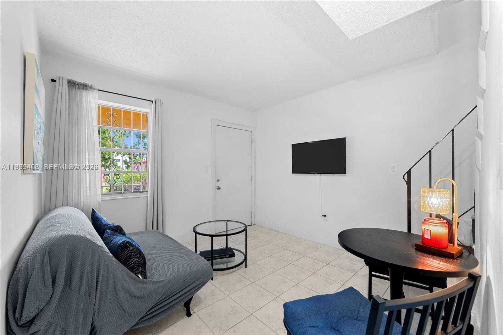 515 Southwest 3rd Street, Unit 6 Miami, FL 33130 - Photo 3 of 19 a living room with furniture and a window