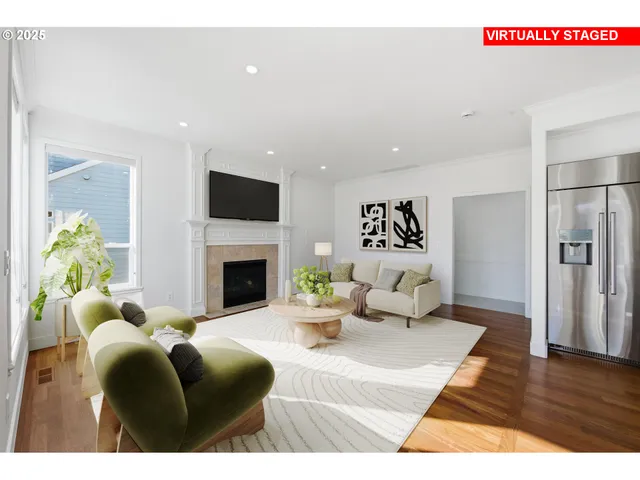 a living room with furniture a fireplace and a flat screen tv