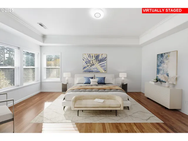 a bedroom with a bed and a large mirror