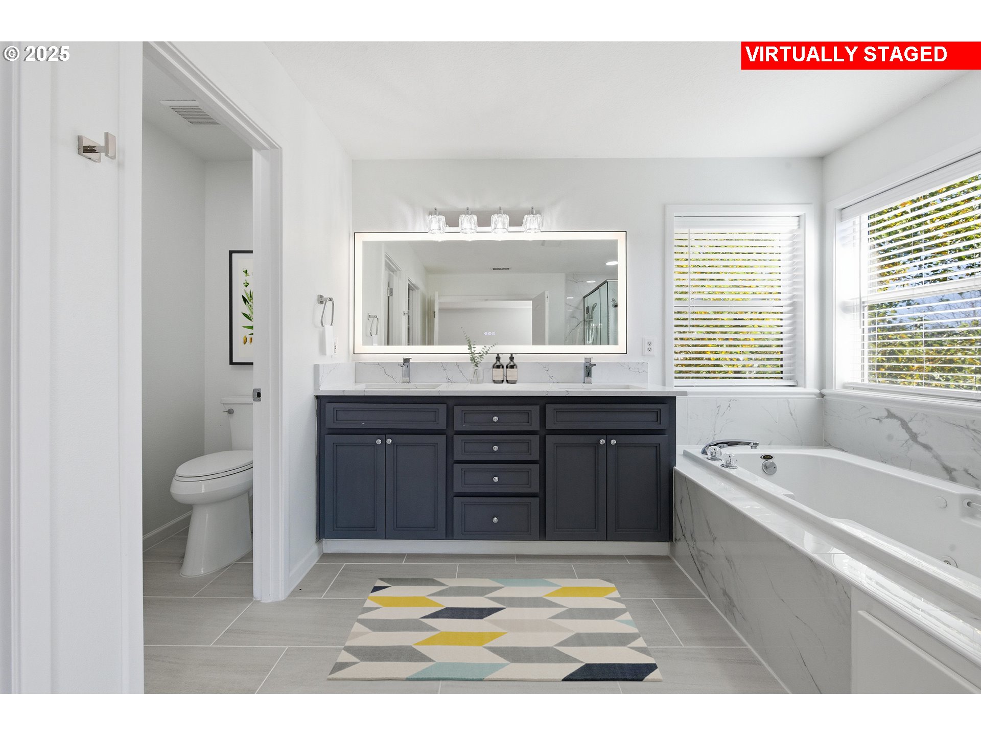 17808 Northwest Pioneer Road Beaverton, OR 97006 - Photo 19 of 43 a spacious bathroom with a tub a double vanity sink a mirror and a bathtub