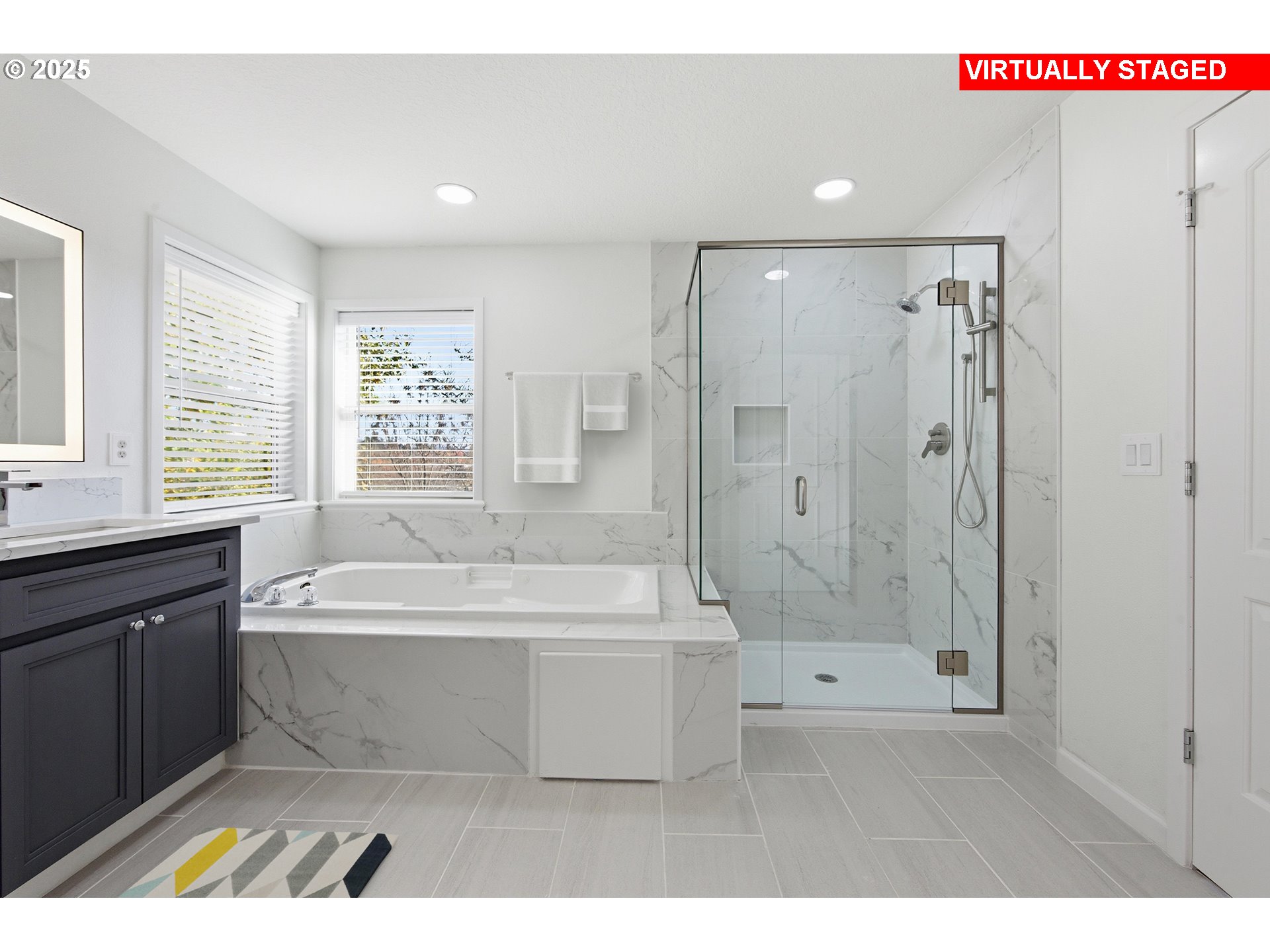 17808 Northwest Pioneer Road Beaverton, OR 97006 - Photo 21 of 43 a spacious bathroom with a bathtub a shower and a sink