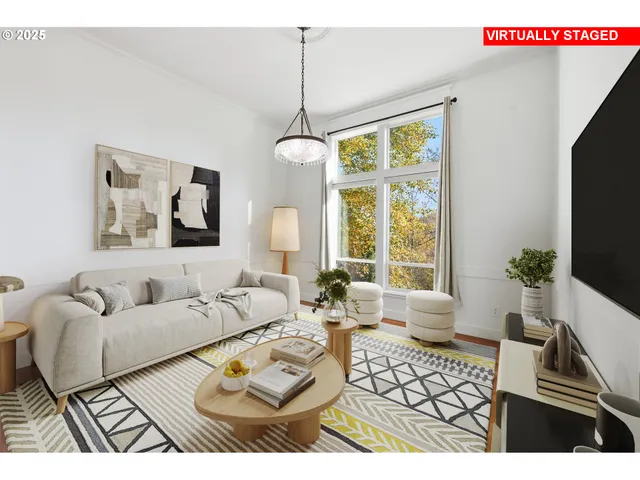 a living room with furniture a dining table and a flat screen tv