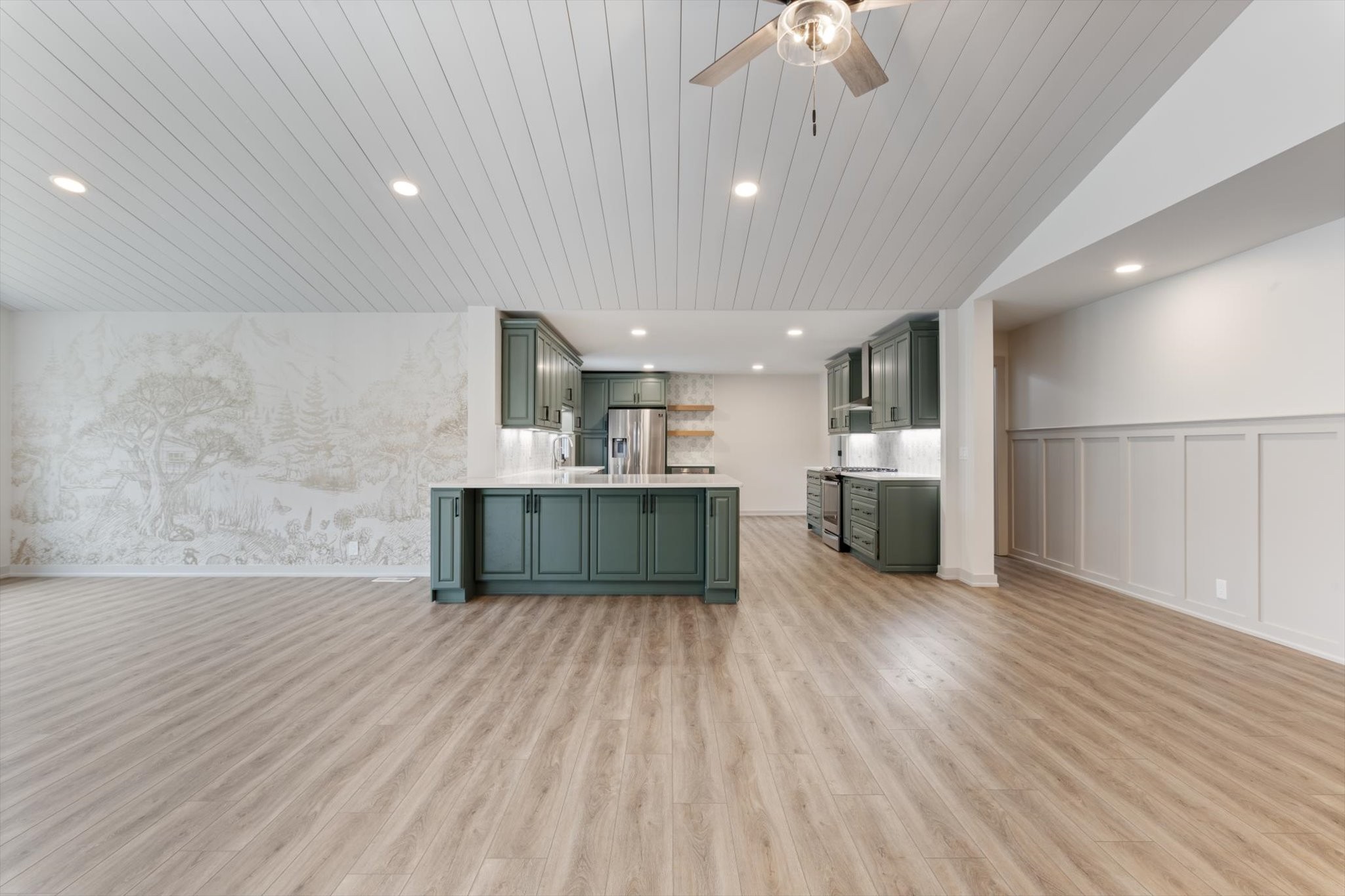 4158 Arno Road Franklin, TN 37064 - Photo 12 of 44 a large kitchen with a wooden floor and stainless steel appliances