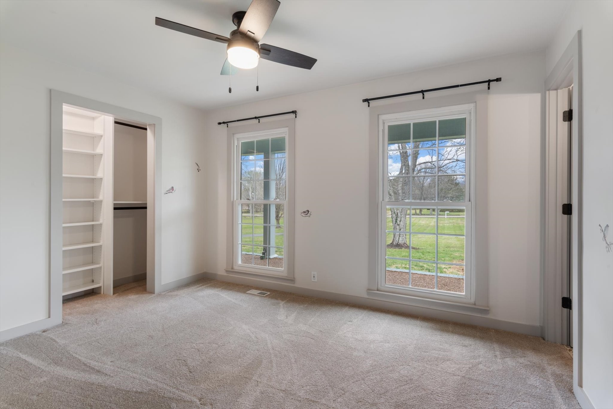 4158 Arno Road Franklin, TN 37064 - Photo 20 of 44 a view of an empty room with a window and a kitchen