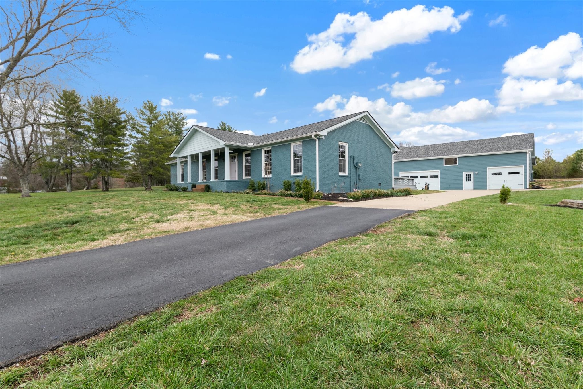 4158 Arno Road Franklin, TN 37064 - Photo 3 of 44 a front view of a house with a yard and trees