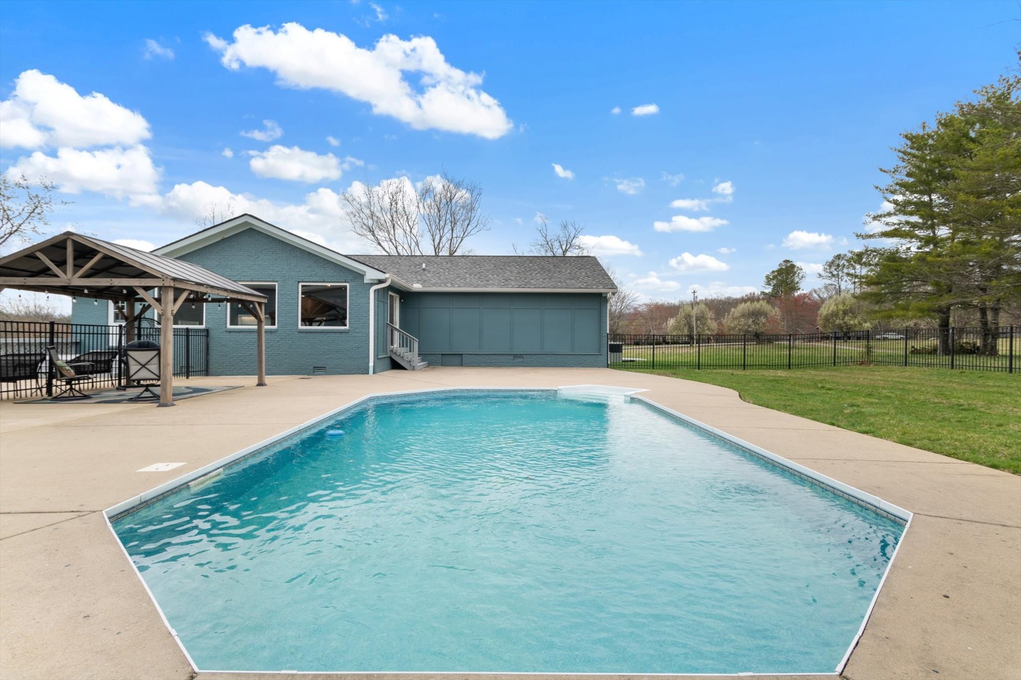 4158 Arno Road Franklin, TN 37064 - Photo 5 of 44 a swimming pool with outdoor seating and yard