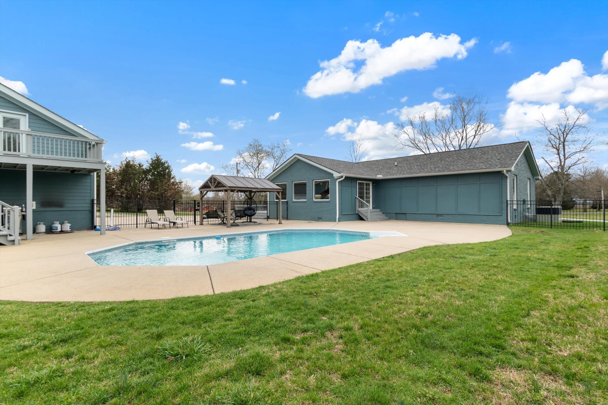 4158 Arno Road Franklin, TN 37064 - Photo 6 of 44 a view of a house with swimming pool and a yard