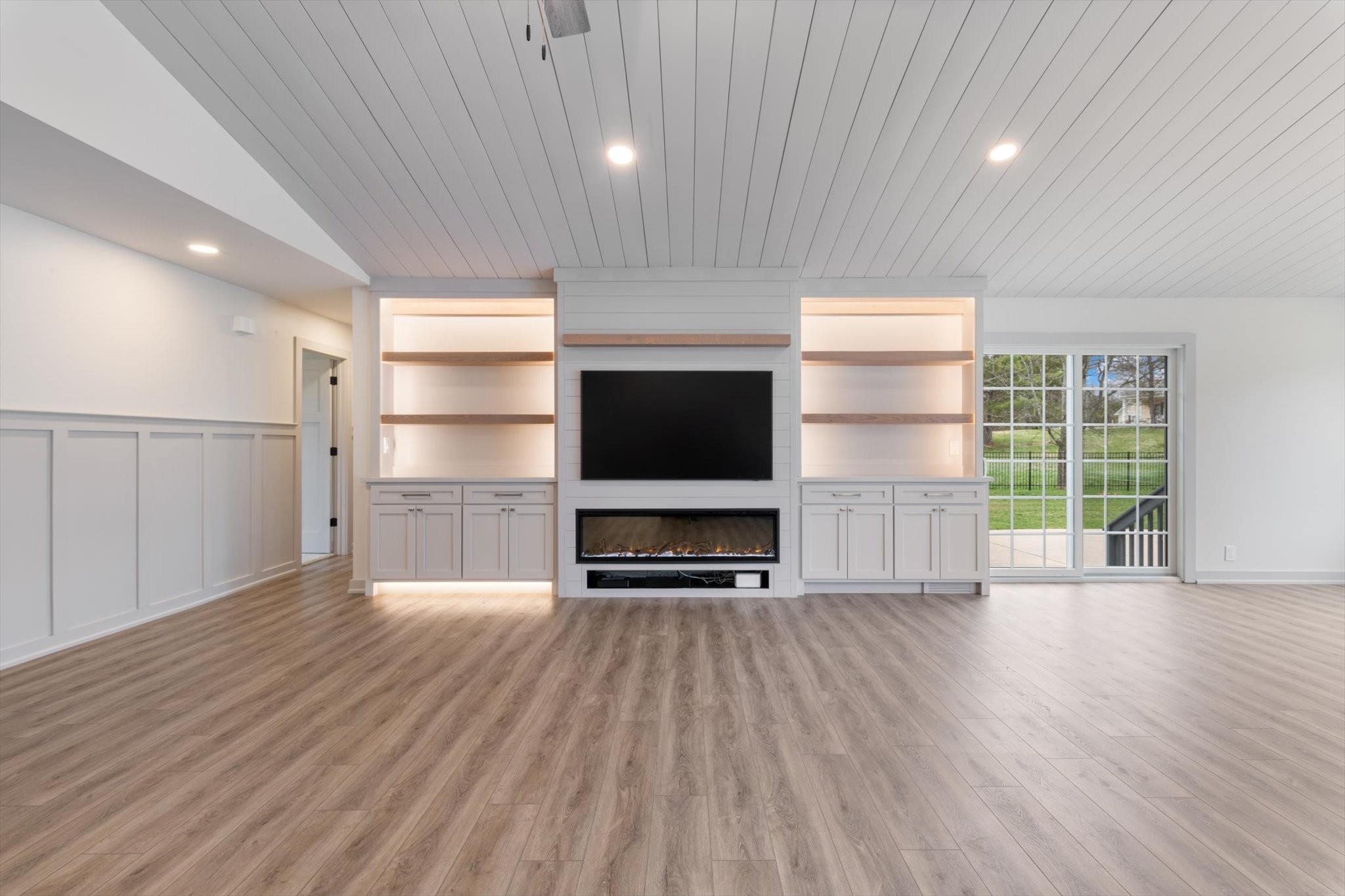 4158 Arno Road Franklin, TN 37064 - Photo 9 of 44 an empty room with wooden floor cabinet and windows