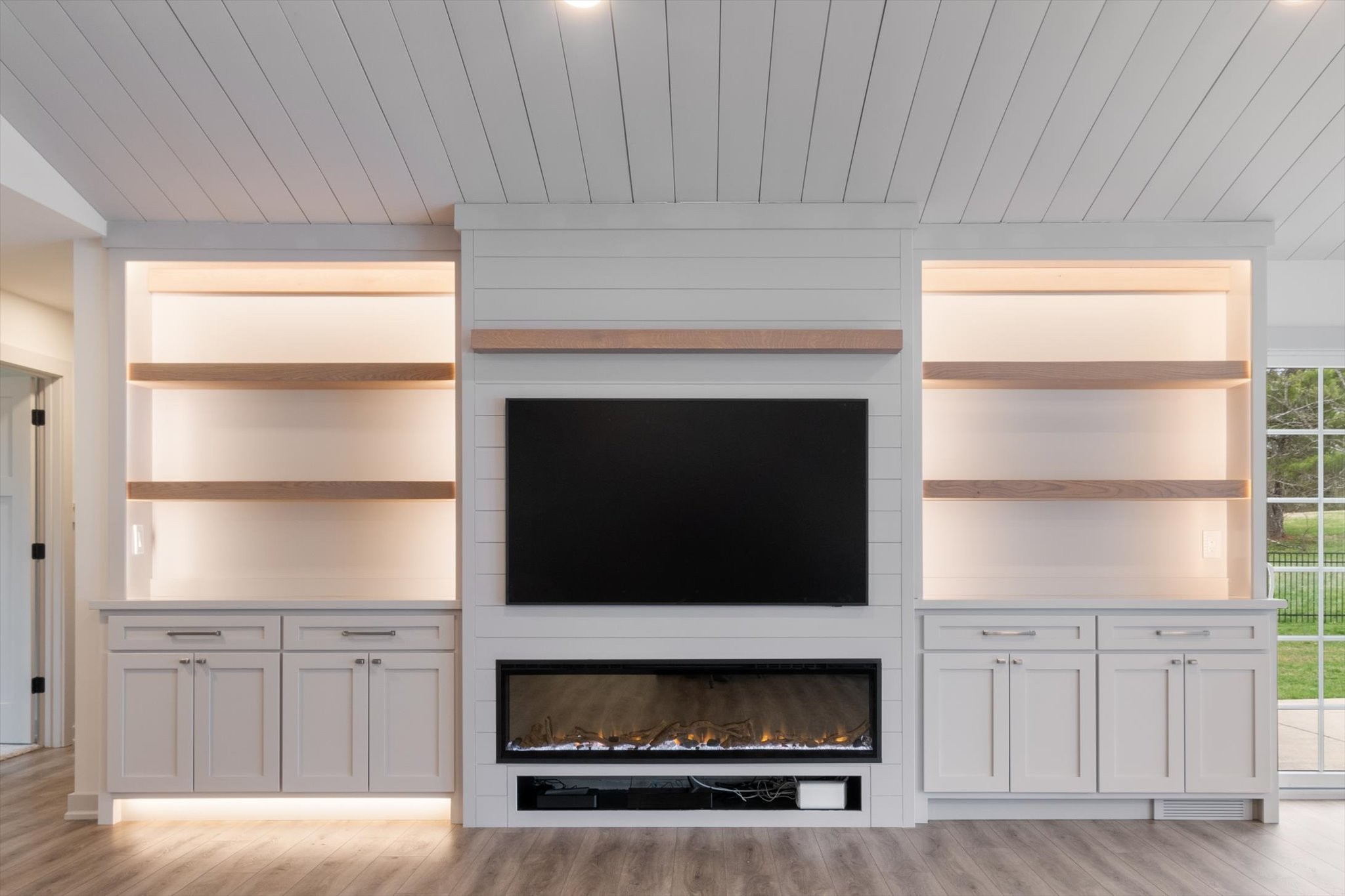 4158 Arno Road Franklin, TN 37064 - Photo 10 of 44 a living room with furniture a flat screen tv and a fireplace
