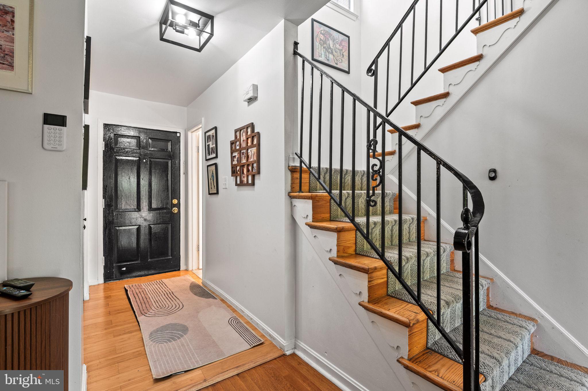 1007 Arcola Avenue Silver Spring, MD 20902 - Photo 2 of 33 Warm entry with hardwood floors and stairs.