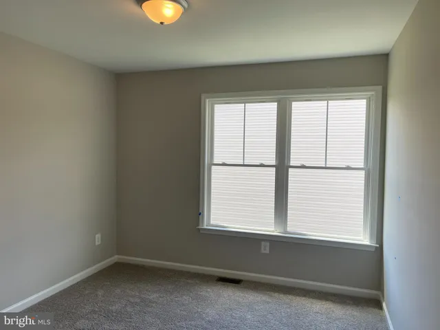 an empty room with window