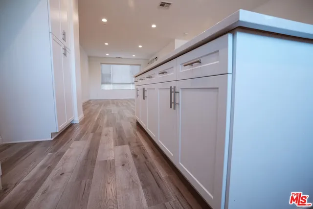 a view of gallery with wooden floor