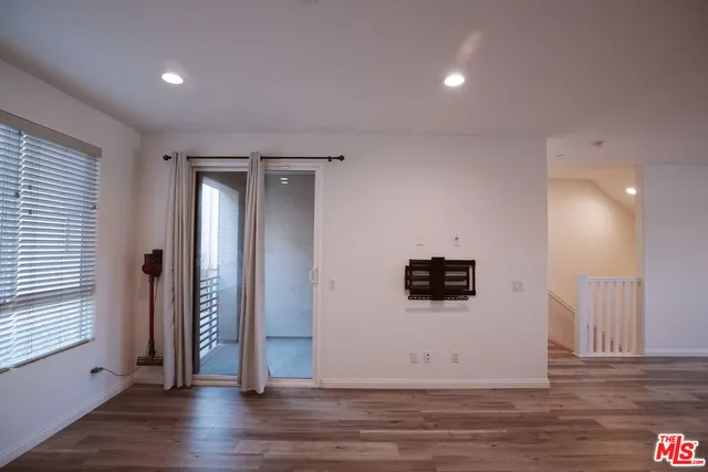 a view of a livingroom with wooden floor