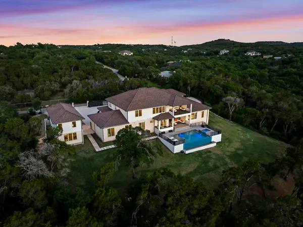a aerial view of a house with mountain view