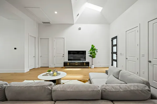a living room with furniture and a flat screen tv