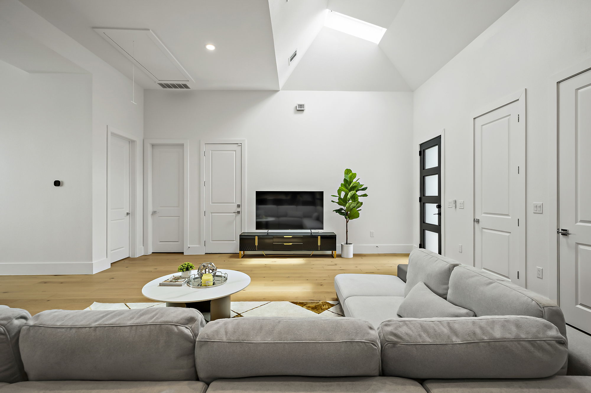 10211 Thistle Ridge Austin, TX 78733 - Photo 30 of 39 a living room with furniture and a flat screen tv