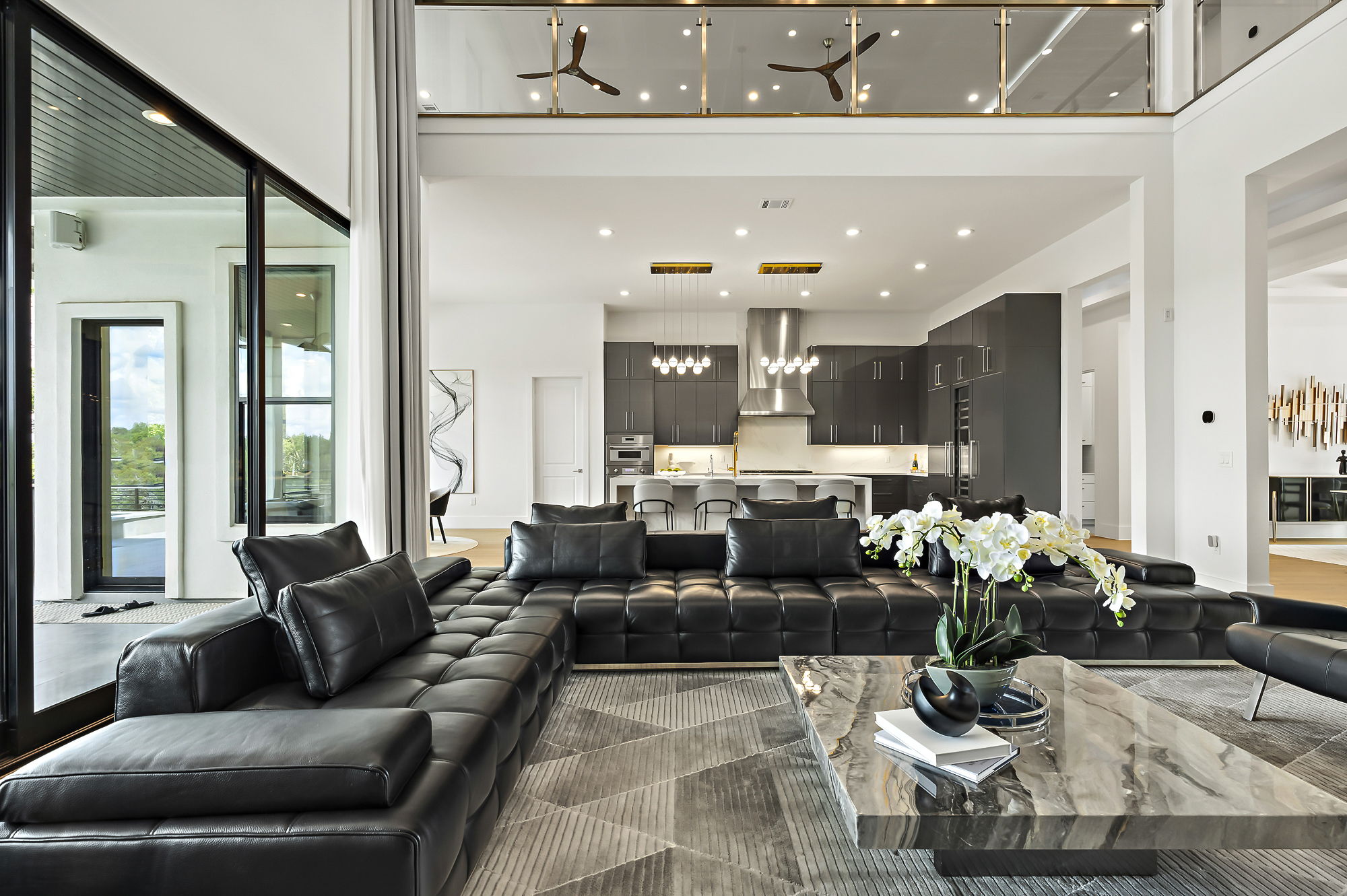 10211 Thistle Ridge Austin, TX 78733 - Photo 3 of 39 a living room with kitchen island furniture and a potted plant