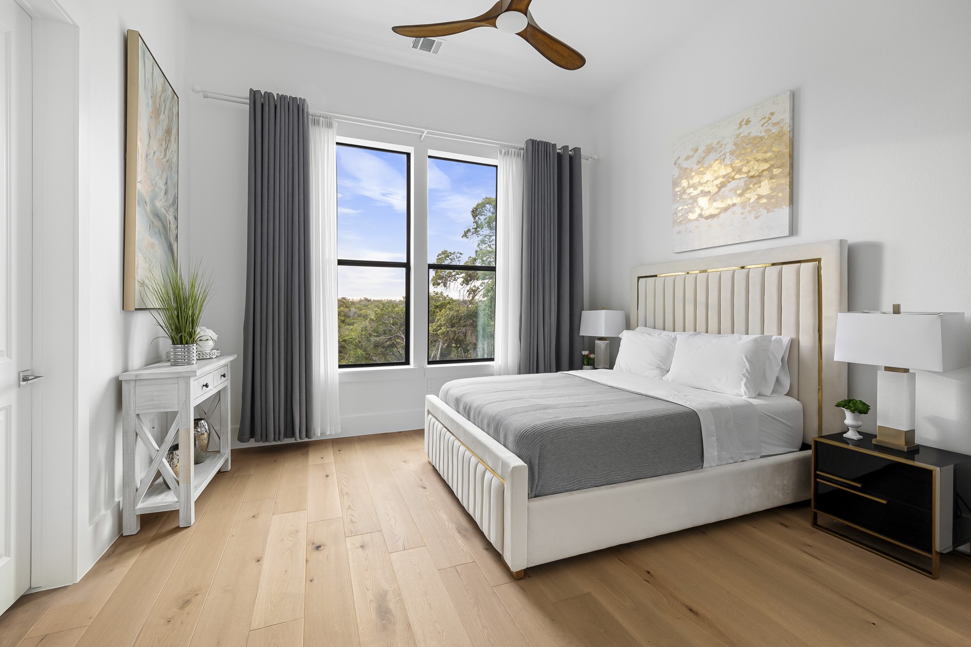 10211 Thistle Ridge Austin, TX 78733 - Photo 38 of 39 a large bed sitting in a bedroom next to a window