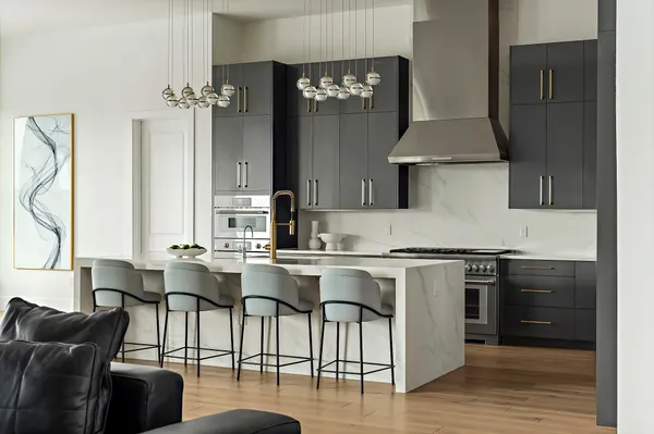 a kitchen with a table chairs stove and cabinets
