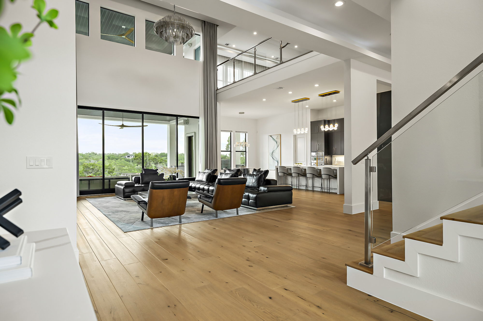 10211 Thistle Ridge Austin, TX 78733 - Photo 9 of 39 a living room with fireplace furniture and a large window
