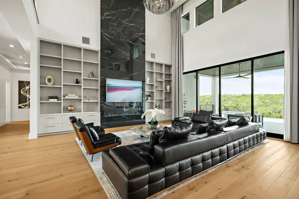 a living room with furniture window and a flat screen tv