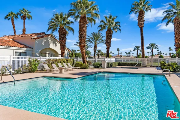 a view of a swimming pool with a garden