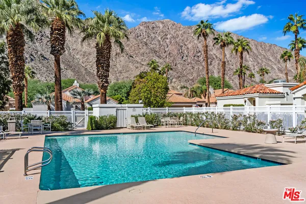 a view of a swimming pool with a patio