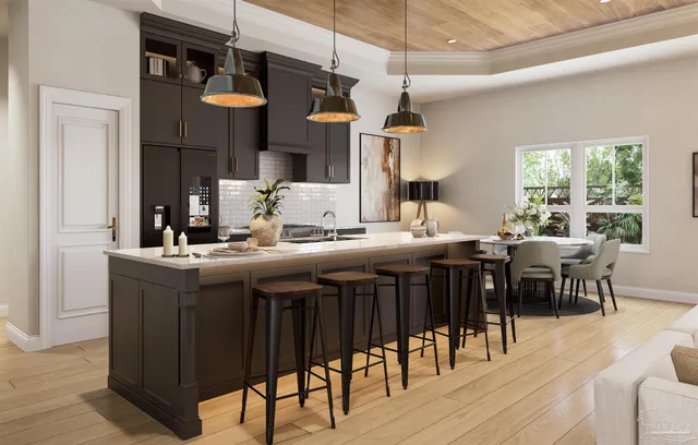 a kitchen with a dining table chairs and white cabinets