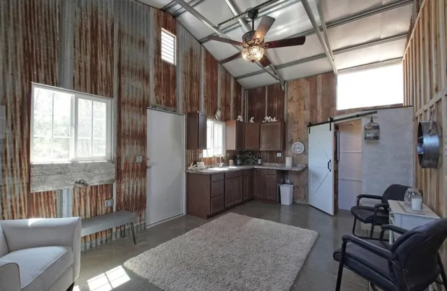 a view of a livingroom with furniture and chandelier