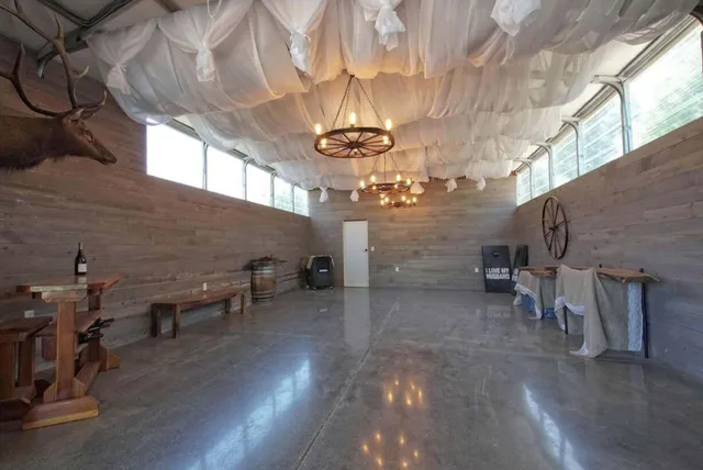 a view of a livingroom with a furniture window and outside view