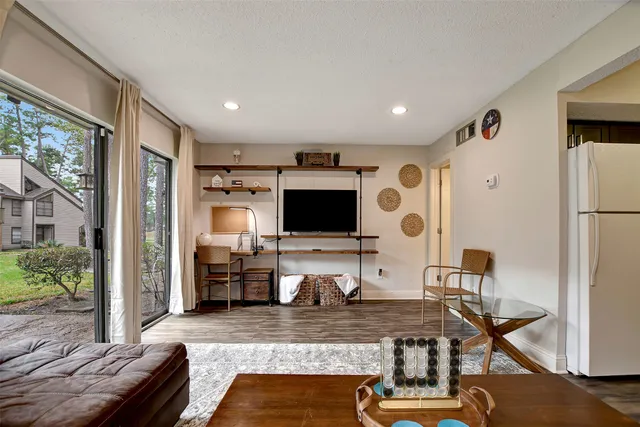 a view of a living room and dining room