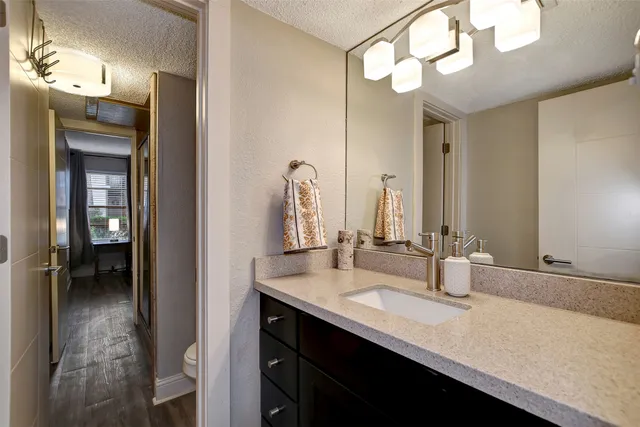 a bathroom with a sink double vanity and a mirror