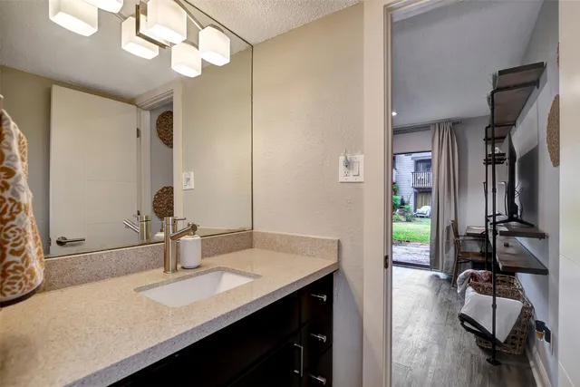 a bathroom with a sink double vanity and a mirror