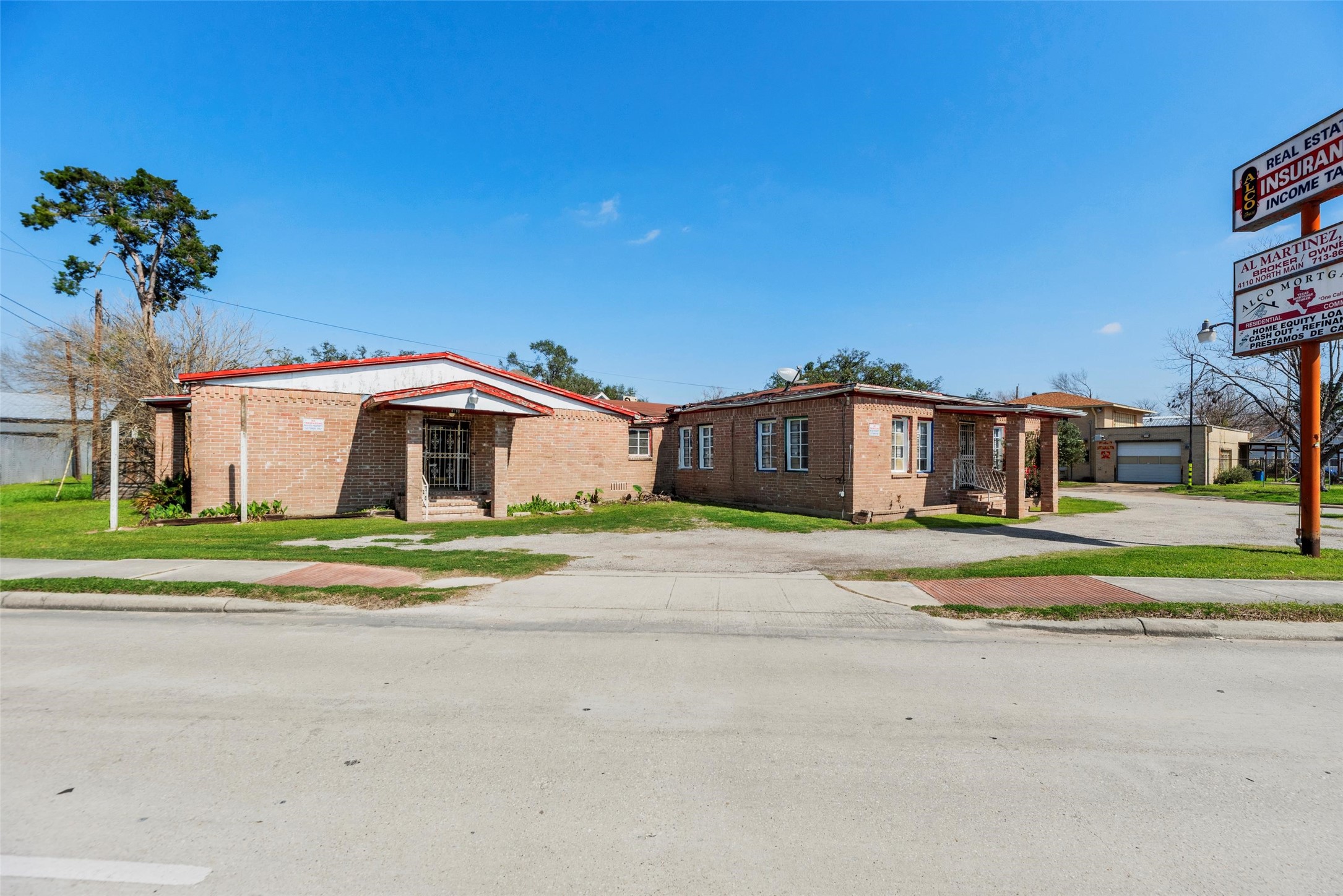 4110 North Main Street Houston, TX 77009 - Photo 13 of 19 a front view of a house with a yard and parking