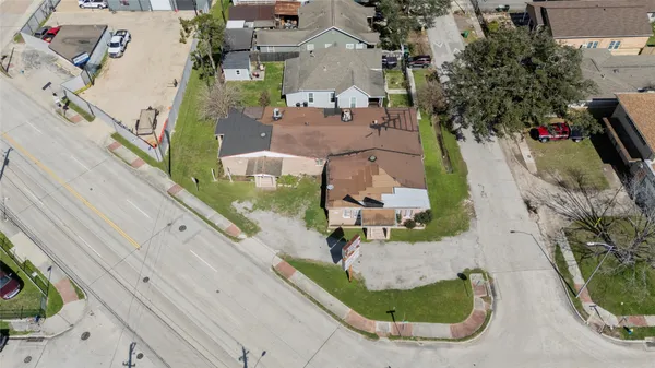 an aerial view of a house with outdoor space