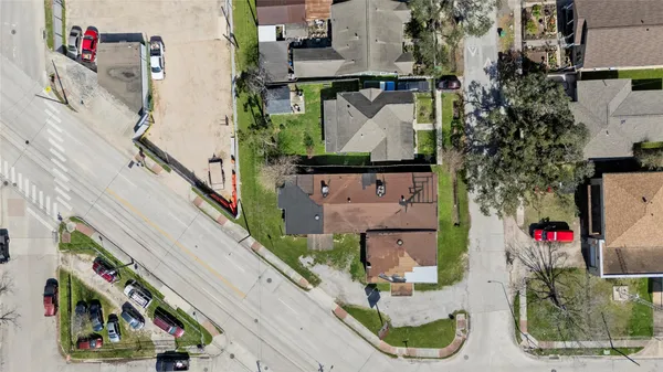 an aerial view of residential houses with city view