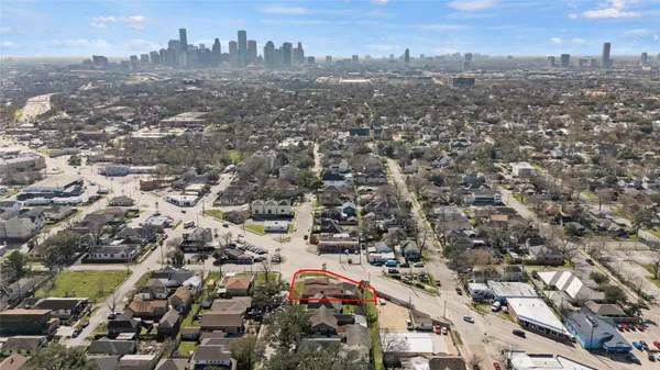 an aerial view of residential houses with city view
