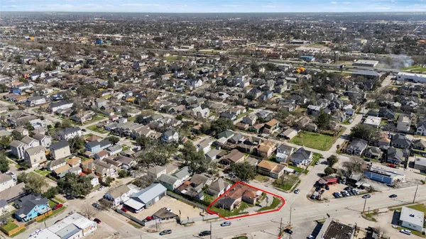 an aerial view of residential houses with city view