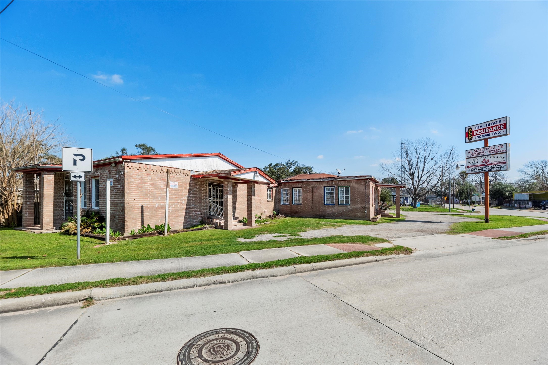 4110 North Main Street Houston, TX 77009 - Photo 9 of 19 a view of yellow house with a big yard and large trees
