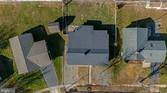 an aerial view of a house with outdoor space