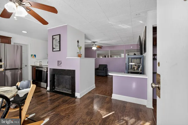 a view of kitchen with furniture and wooden floor