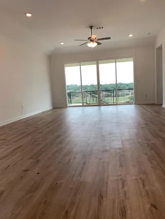 a view of an entryway with wooden floor