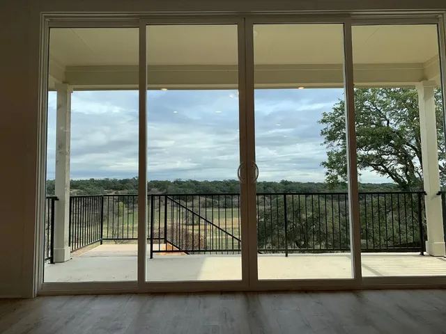 a view of a room with yard from a window