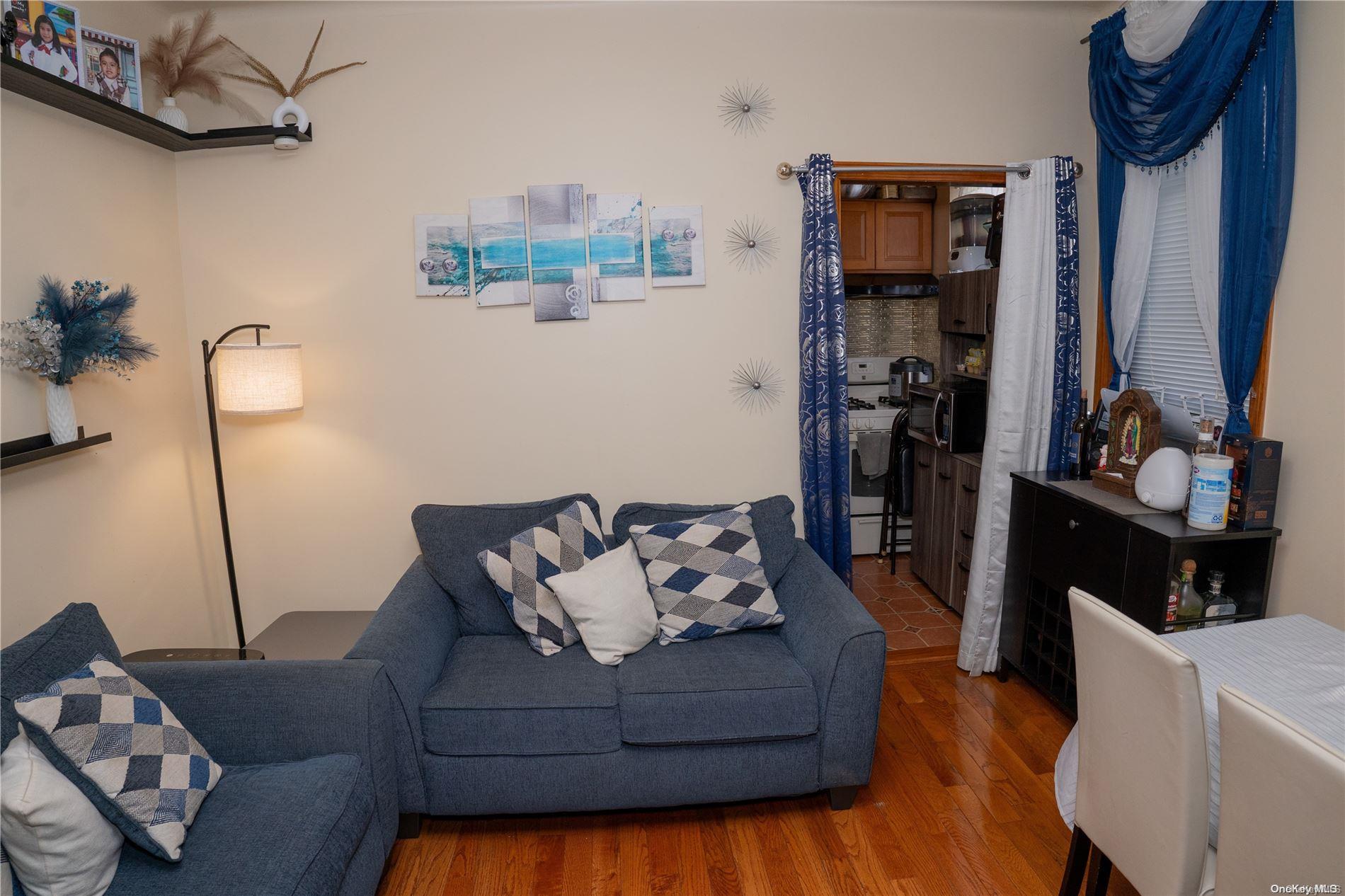 40-61 Junction Boulevard Queens, NY 11368 - Photo 4 of 13 a living room with furniture