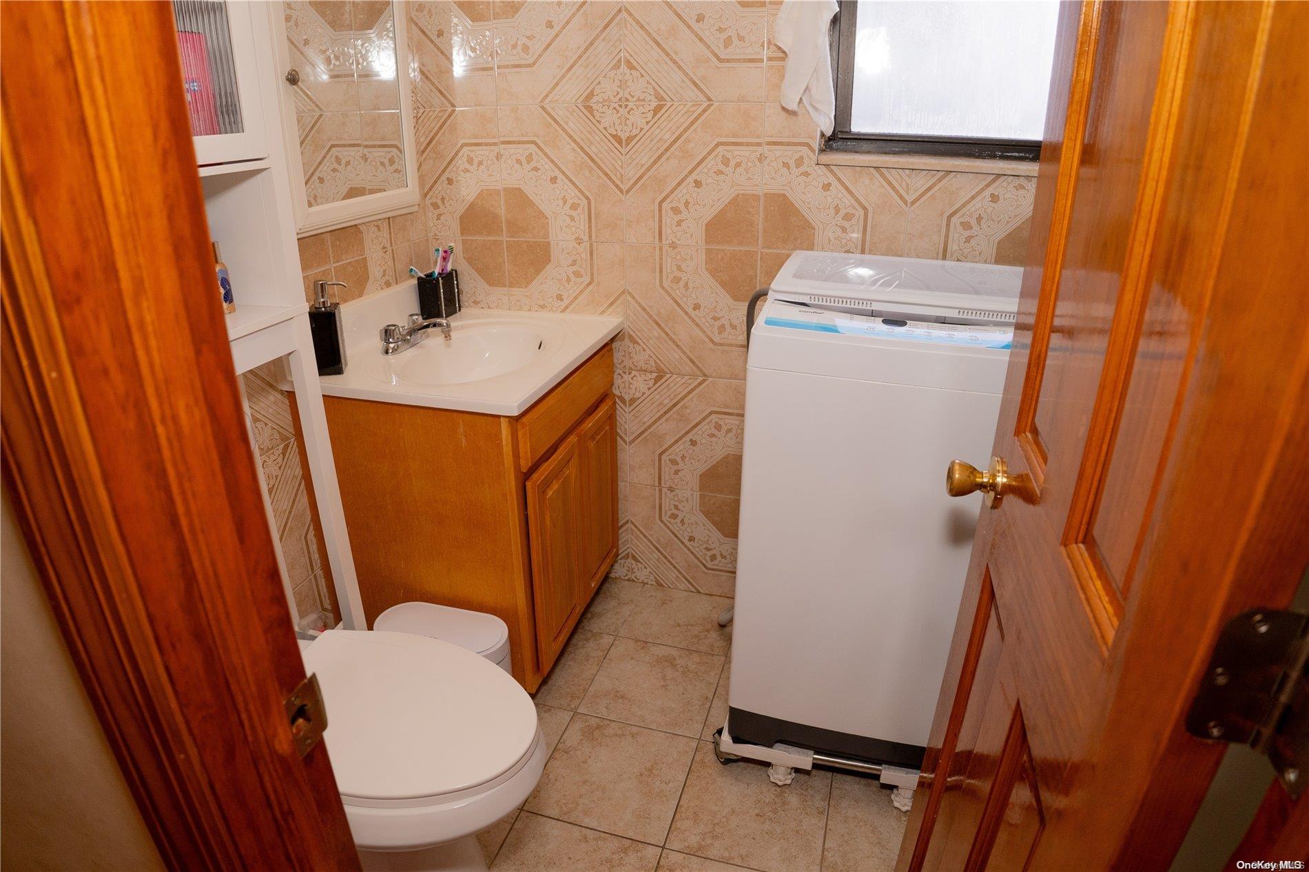 40-61 Junction Boulevard Queens, NY 11368 - Photo 7 of 13 a bathroom with sink toilet and shower