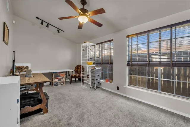 a room with gym equipment and a large window