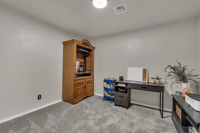 a view of a workspace with furniture