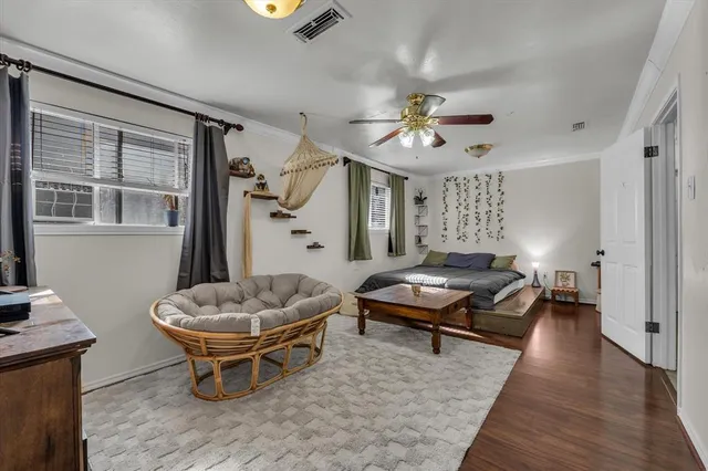 a living room with furniture a rug and a chandelier